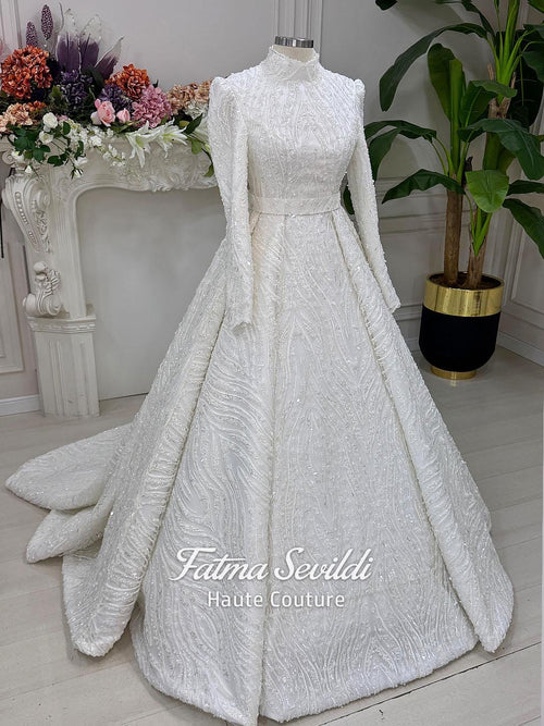 White A-line hijab wedding dress with beaded lace, high neck, long sleeves
