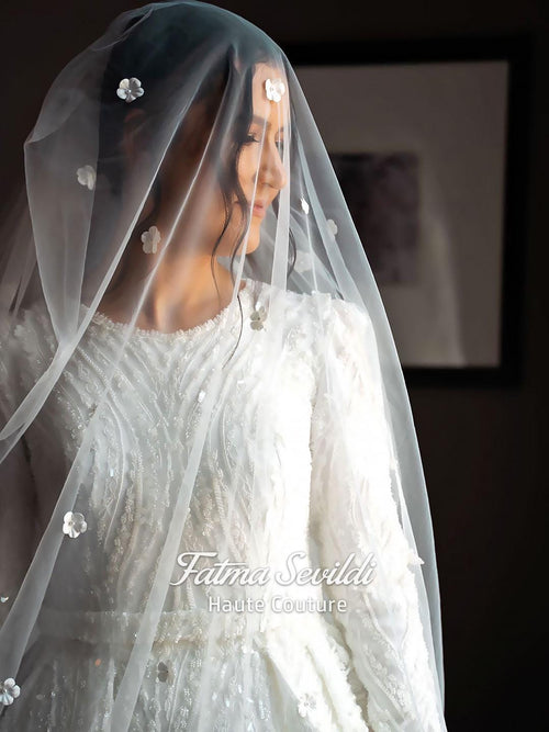 Delicate white lace veil with sparkling floral embellishments for elegant Muslim wedding gown