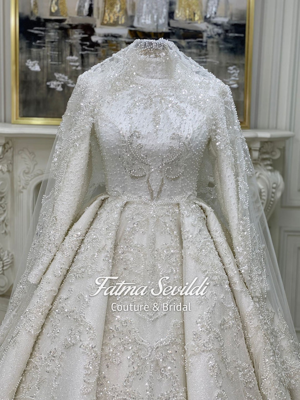 Luxurious ivory veiled modest wedding gown with beaded lace, high neck, long sleeves