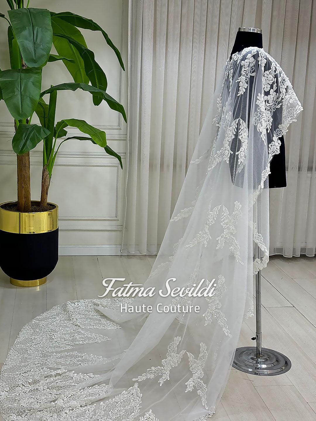 Elegant lace bridal cape veil with floral embroidery and cathedral train