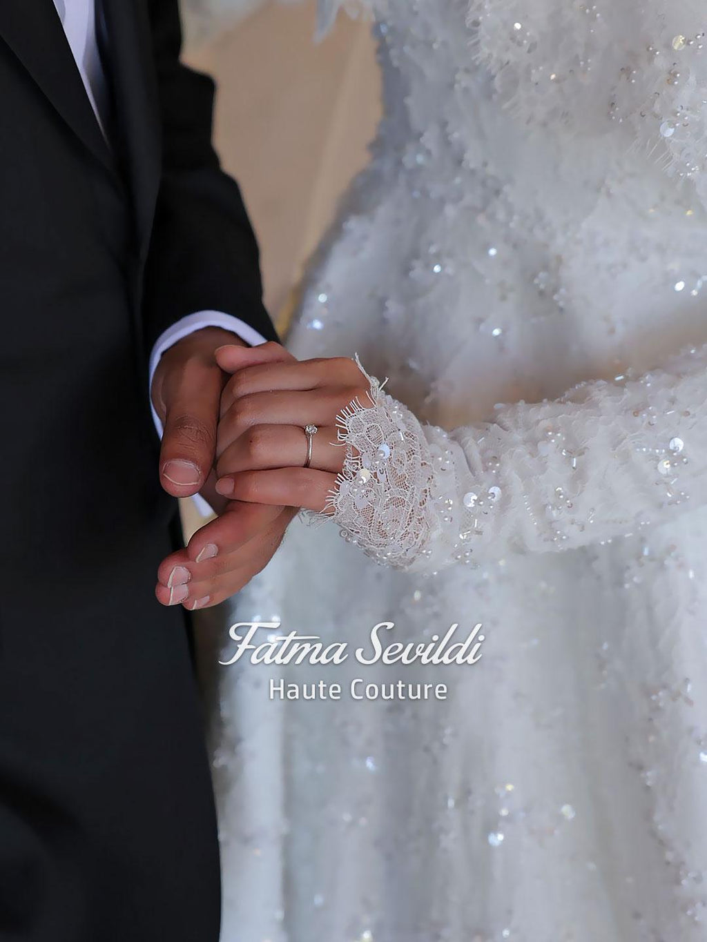 Bride in elegant veiled hijab beaded lace A-line wedding dress with gold band
