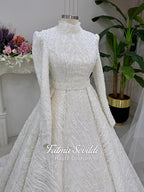 White A-line hijab wedding dress with beaded lace, long sleeves