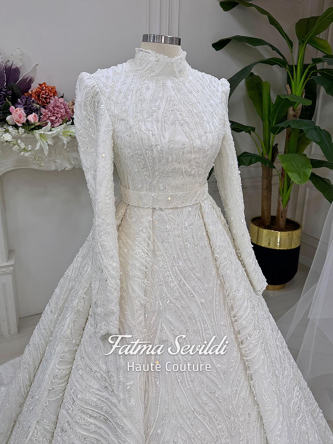 White A-line hijab wedding dress with beaded lace, long sleeves