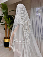Delicate white lace bridal veil with floral embroidery by Fatma Sevildi