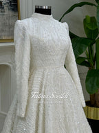White beaded lace hijab wedding dress with high neck and long sleeves