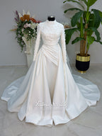 Luxury modest hijab wedding dress with long sleeves, 3D floral beaded lace bodice, draped satin A-line skirt and lace-edged veil included, shown on mannequin. Custom made Islamic bridal gown with elegant full coverage.