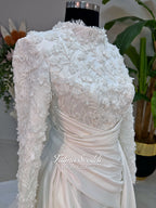 Luxury modest hijab wedding dress with long sleeves, 3D floral beaded lace bodice, draped satin A-line skirt and lace-edged veil included, shown on mannequin. Custom made Islamic bridal gown with elegant full coverage.