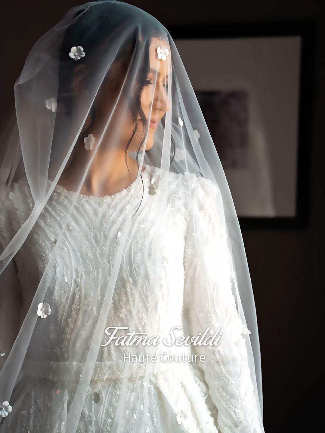 Delicate white lace veil with sparkling floral embellishments for elegant Muslim wedding gown