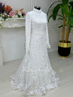 Elegant mermaid hijab wedding dress in white lace with high neck, long sleeves, 3D floral embroidery, and detachable skirt
