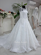 Luxury white hijab wedding dress with long floral lace sleeves, a beaded princess skirt, illusion boat neckline, and a matching premium lace-edged veil.