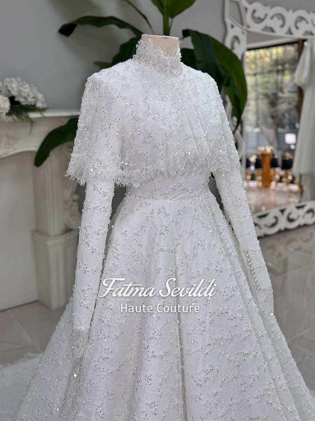 Elegant veiled hijab wedding dress with beaded lace cape, high neck, long sleeves