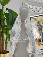 Elegant white lace bridal veil with floral embroidery and beaded headpiece