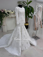 White beaded mermaid hijab wedding dress with long sleeves and high neck