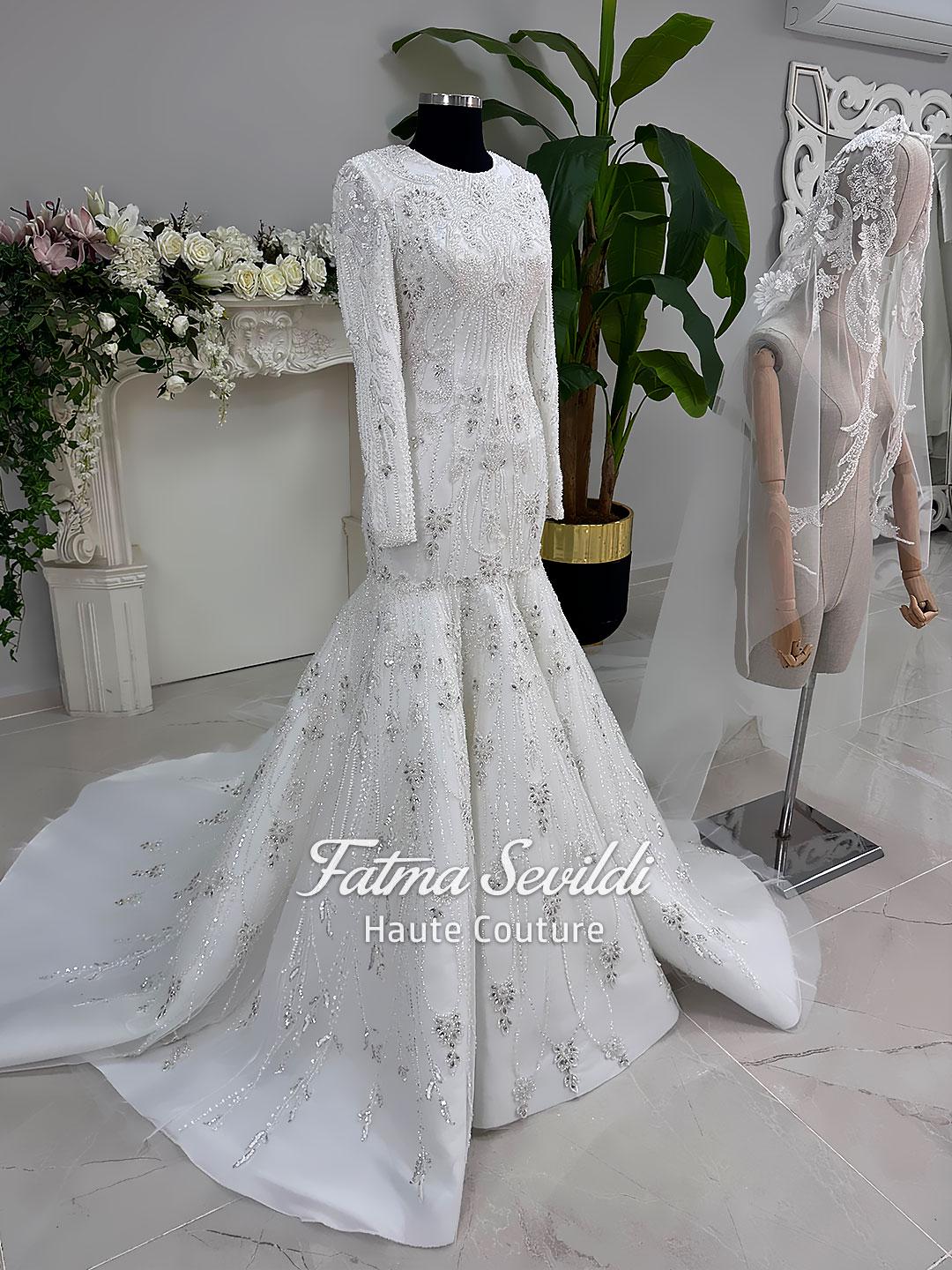 White beaded mermaid hijab wedding dress with long sleeves and high neck