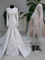 White beaded mermaid hijab wedding gown, long sleeve high neck on mannequin