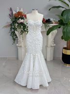 3-in-1 white hijab wedding dress with a beaded mermaid gown, detachable overskirt and long sleeve high-neck bridal topper. Convertible modest bridal set with dimensional floral lace and a coordinating lace veil.