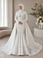 3-in-1 white hijab wedding dress with a beaded mermaid gown, detachable overskirt and long sleeve high-neck bridal topper. Convertible modest bridal set with dimensional floral lace and a coordinating lace veil.