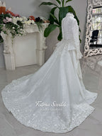 3-in-1 white hijab wedding dress with a beaded mermaid gown, detachable overskirt and long sleeve high-neck bridal topper. Convertible modest bridal set with dimensional floral lace and a coordinating lace veil.