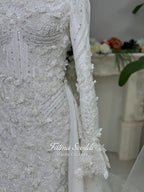3-in-1 white hijab wedding dress with a beaded mermaid gown, detachable overskirt and long sleeve high-neck bridal topper. Convertible modest bridal set with dimensional floral lace and a coordinating lace veil.