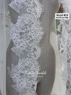 White A-line satin hijab wedding dress with long sleeves, high neckline, floral appliqué embroidery and an included premium lace mantilla veil for a modest Muslim bridal look.