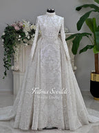 Luxury modest hijab wedding dress with white lace, silver embroidery, long sleeves, veil, and beading on mannequin