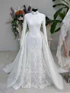 White hijab wedding dress with long sleeves, floral lace, high neckline and detachable overskirt, styled with a premium lace veil. Luxury modest bridal gown designed for a fully covered Muslim bridal look.