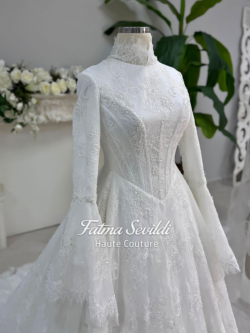 Elegant modest hijab wedding dress with lace corset bodice and bell sleeves