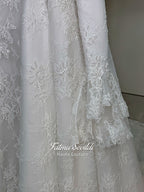 Luxury hijab wedding dress with A-line silhouette, beaded lace detailing and cathedral lace veil, modest long sleeve bridal gown for Muslim bride