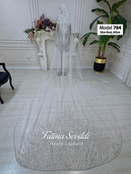 Sheer white cathedral bridal veil with hand-sewn silver beaded lace edges