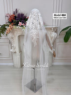 Delicate white lace tulle bridal veil model 404 with floral embroidery