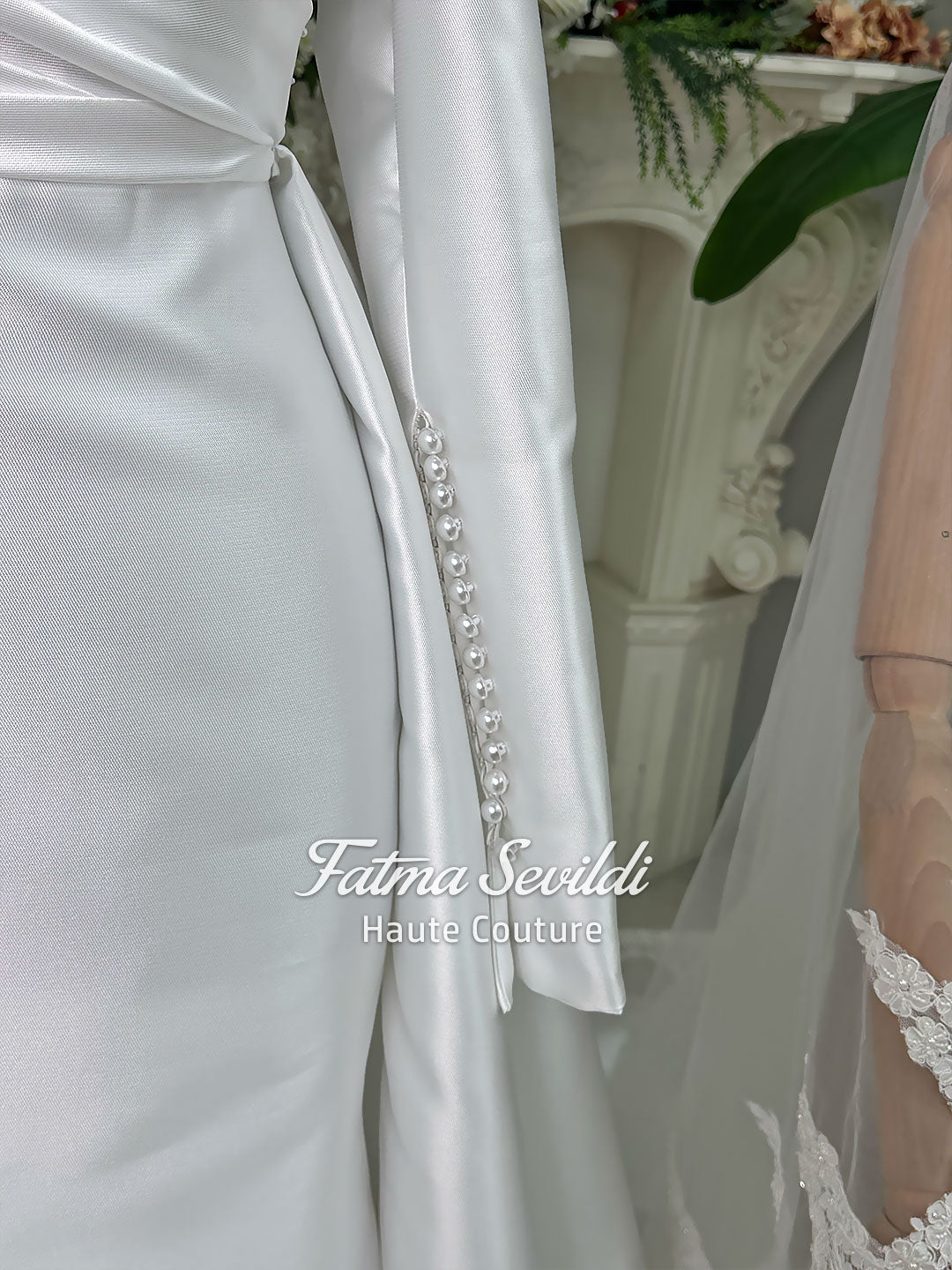 Luxury satin hijab wedding dress with off-shoulder long sleeves and an A-line silhouette, shown with premium lace veil and dramatic train. Custom couture modest bridal gown design with elegant draping and pearl details.