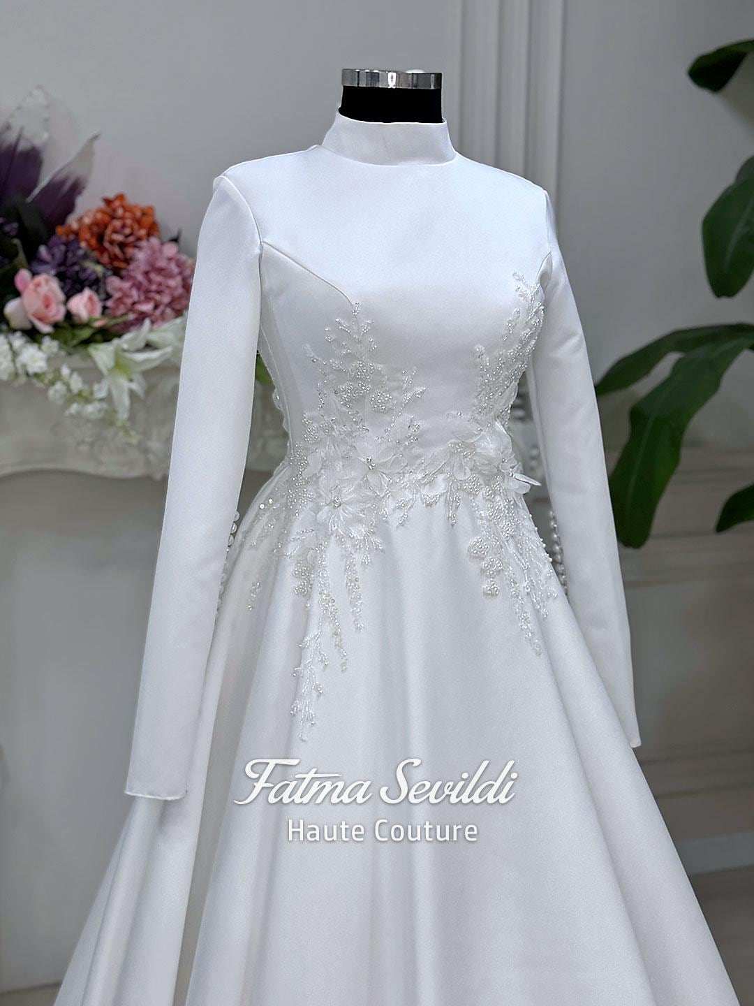 Elegant white satin Veiled 3D floral hijab wedding gown with silver beaded embroidery