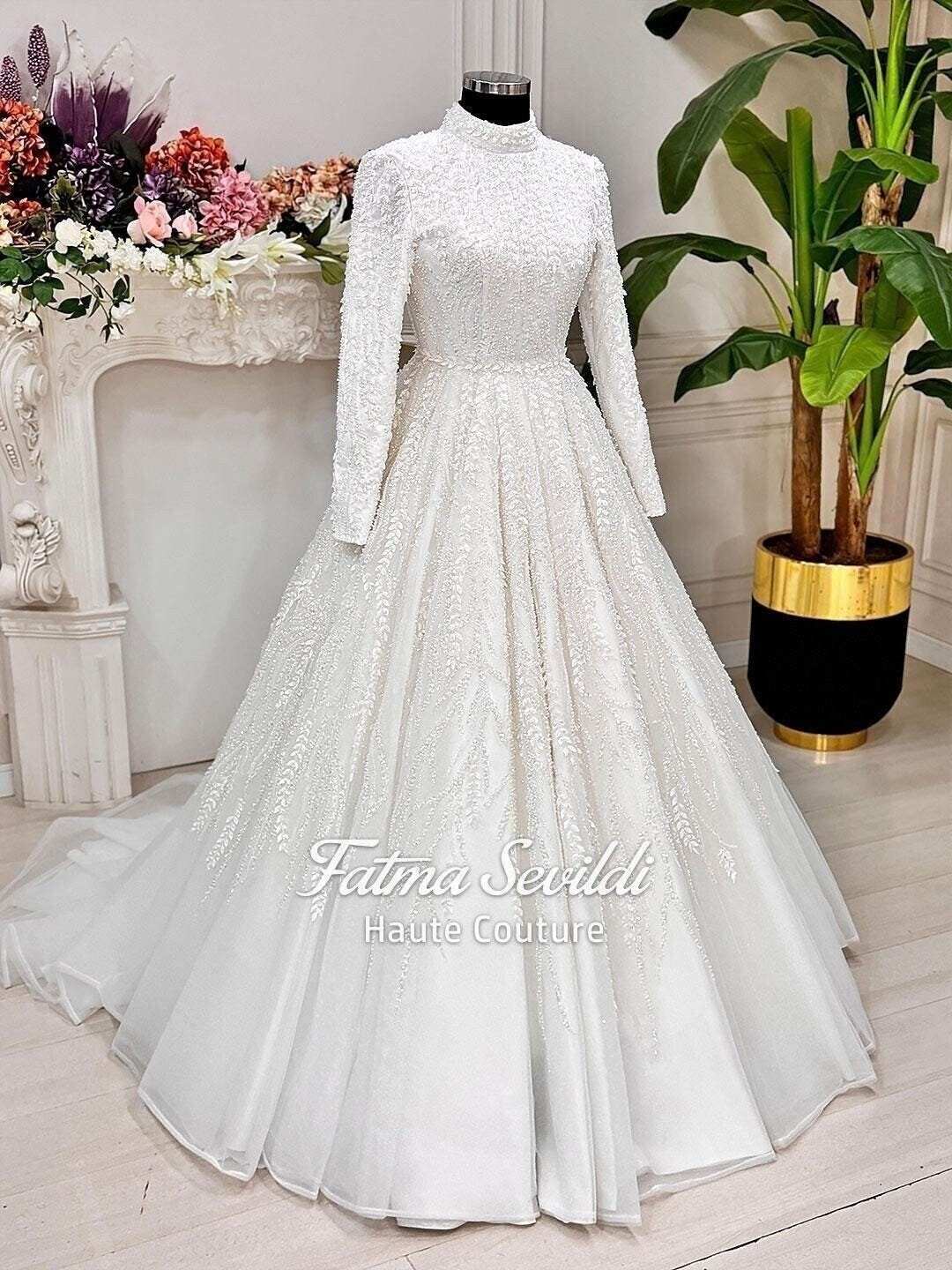 Veiled beaded lace hijab wedding dress with high neck long sleeves
