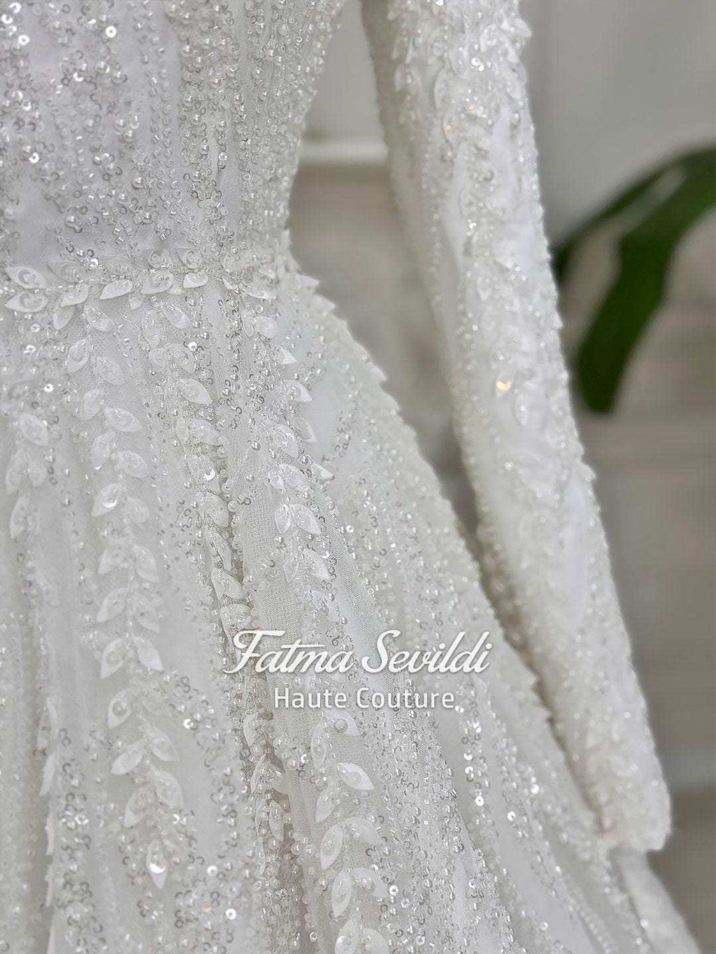 White veiled beaded lace hijab wedding dress with high neck and long sleeves
