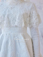 Delicate white lace hijab wedding gown with floral embroidery by Fatma Sevildi