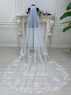 Luxury veiled hijab wedding dress with beaded lace, long sleeves, full coverage bodice, and elegant A-line bridal silhouette. Modest Muslim wedding gown with custom couture detailing and romantic lace veil.