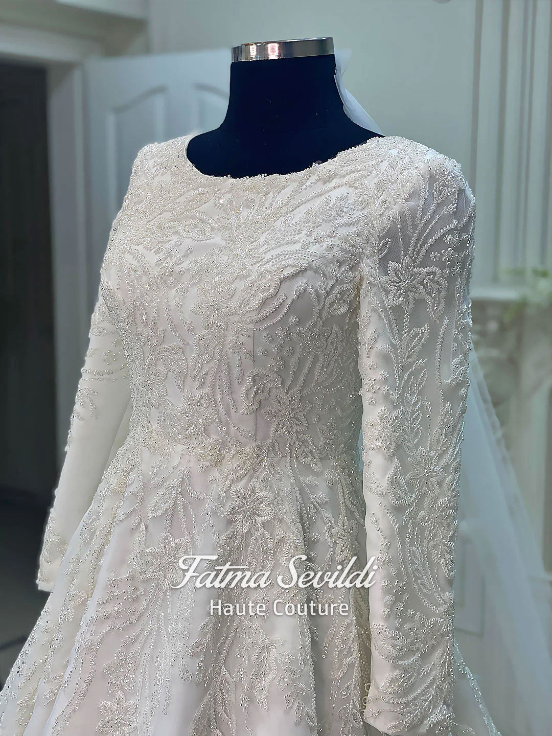 Luxury veiled hijab wedding dress with beaded lace, long sleeves, full coverage bodice, and elegant A-line bridal silhouette. Modest Muslim wedding gown with custom couture detailing and romantic lace veil.