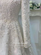 Luxury veiled hijab wedding dress with beaded lace, long sleeves, full coverage bodice, and elegant A-line bridal silhouette. Modest Muslim wedding gown with custom couture detailing and romantic lace veil.