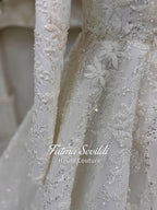 Veiled hijab wedding dress with white lace, silver beading, and floral embroidery