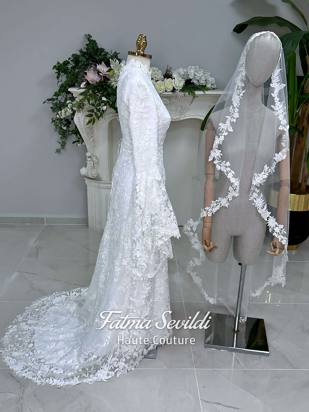 Veiled hijab wedding dress with high neck, long sleeves, and beaded floral lace in an elegant A-line couture silhouette.