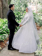 Elegant ivory veiled hijab wedding gown with beaded lace sleeves