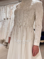Elegant veiled Muslim wedding dress with beaded lace, long sleeves, ivory gown