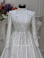 Veiled Pearl hijab wedding dress with silver beaded lace sleeves