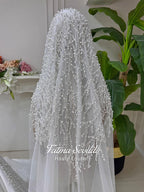 Delicate white sheer veil with silver beading and pearls by Fatma Sevildi
