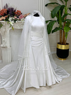 Elegant veiled satin Muslim wedding dress with long sleeves and lace trim