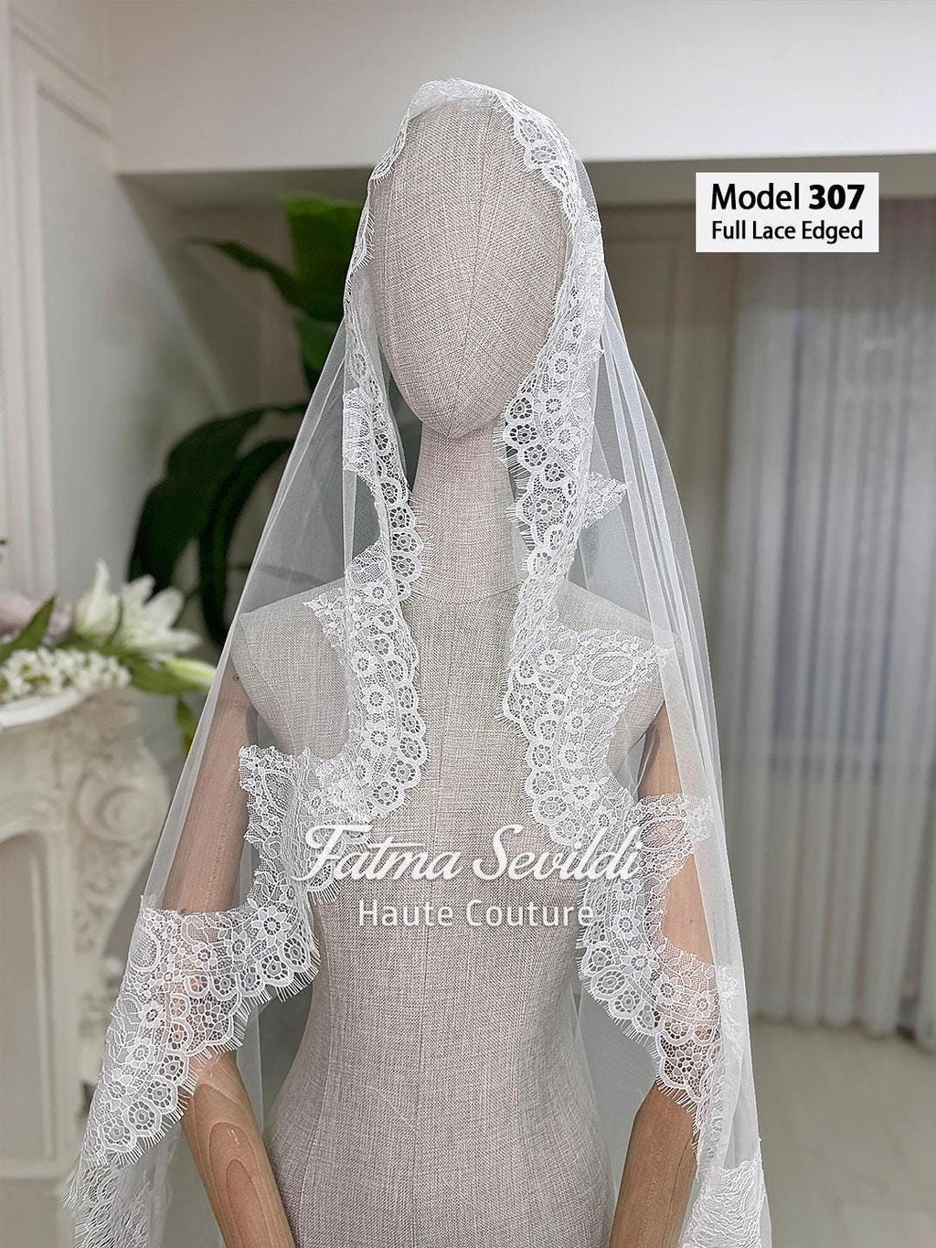 White full lace-edged cathedral veil, model 307 by Fatma Sevildi Haute Couture