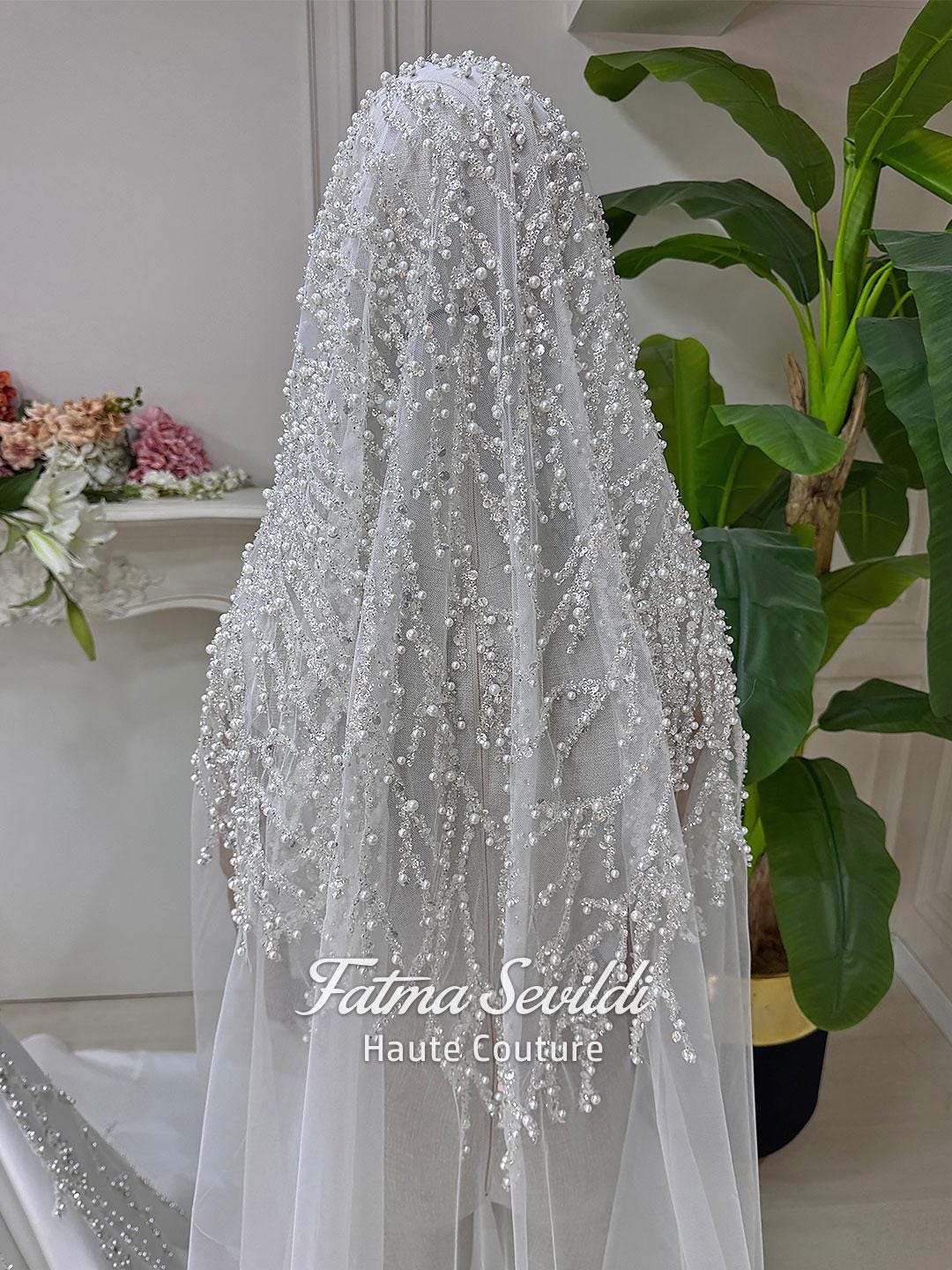 Delicate white sheer veil with silver beading and pearls by Fatma Sevildi