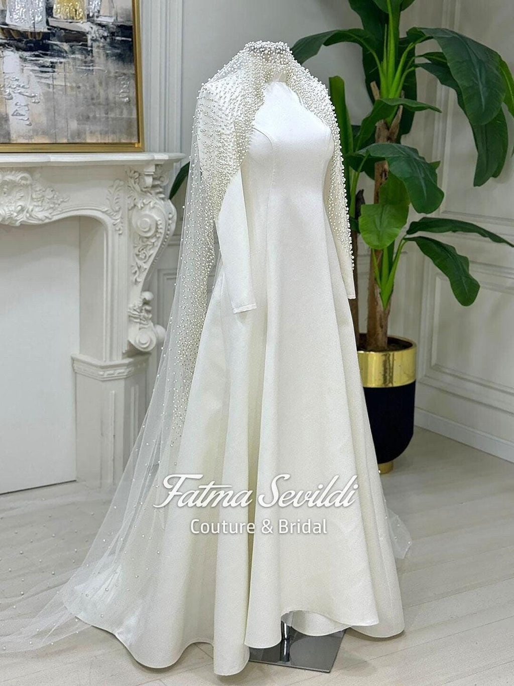 Elegant veiled hijab wedding dress with satin A-line, long sleeves, and beaded veil