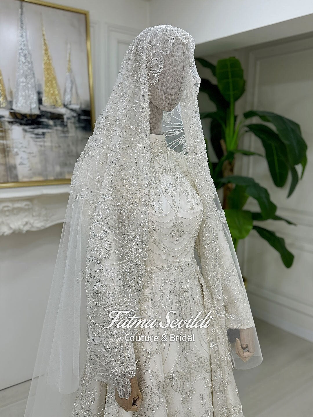 Veiled hijab wedding dress with silver beading, lace sleeves, and sheer veil