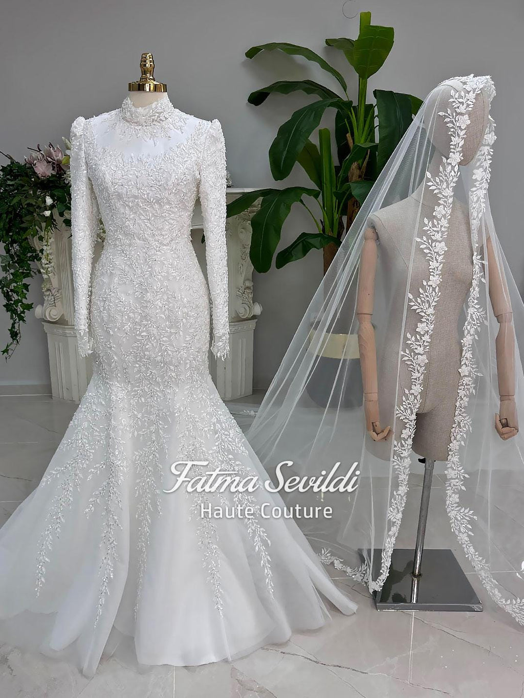 White mermaid hijab wedding gown with lace sleeves and detachable overskirt